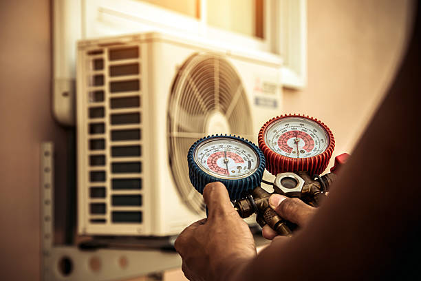 Professional Heat Pump Repair technician working in Spencerville, IN